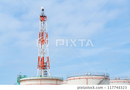Large oil tank and flare stack (flame raising tower) 117748323