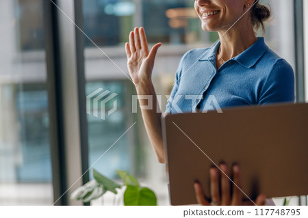 A Professional Woman Actively Engaging in Meaningful Virtual Meeting with Clients and Colleagues A Professional Woman Actively Engaging in Meaningful Virtual Meeting with Clients and Colleagues 117748795