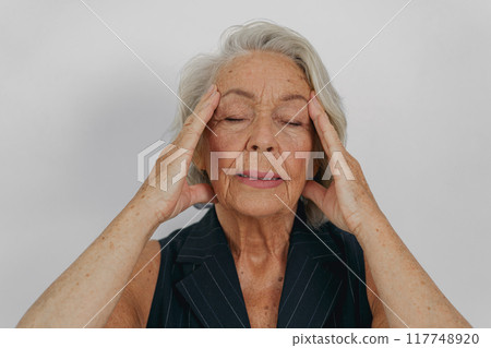 Senior Woman Experiencing Effective and Soothing Stress Relief Techniques and Practices Senior Woman Experiencing Effective and Soothing Stress Relief Techniques and Practices 117748920