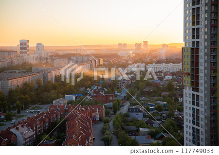 smog smoke over town on sunset. city panorama, street, townhouse, houses, buildings. smoke from summer forest fires, bad ecology smog smoke over town on sunset. city panorama, street, townhouse, houses, buildings. smoke from summer forest fires, bad ecology 117749033