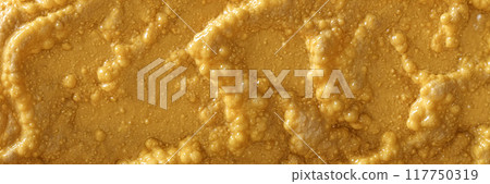 Abstract yellow substance with air bubbles or organic surface texture,  smooth wet and slimy, convex and protruding. Food or organic background, wallpaper, material or banner.  117750319