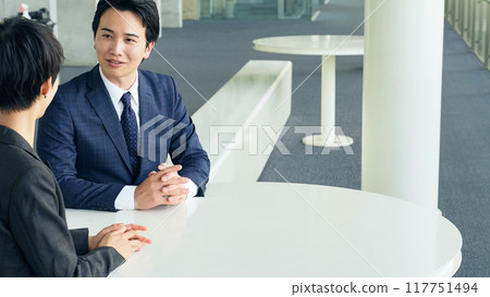 Business person talking in the office Business person talking in the office 117751494