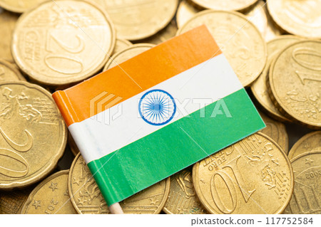 India flag on gold coins, finance and banking business. India flag on gold coins, finance and banking business. 117752584