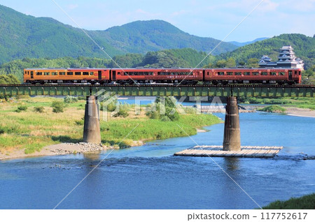 "Iyonada Monogatari" is a tourist train that crosses the Hijikawa River with Ozu Castle in the background. "Iyonada Monogatari" is a tourist train that crosses the Hijikawa River with Ozu Castle in the background. 117752617