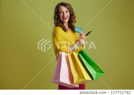 happy healthy woman against green background happy healthy woman against green background 117752782