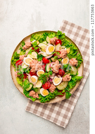 Tuna salad, vegetable salad with quail eggs, lettuce, red onion and cucumbers, on a light gray table, keto food, lifestyle, healthy eating, selective focus, top view, no people, Tuna salad, vegetable salad with quail eggs, lettuce, red onion and cucumbers, on a light gray table, keto food, lifestyle, healthy eating, selective focus, top view, no people, 117753663
