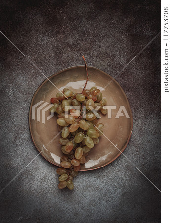 a branch of white grapes, wine grapes, Georgian grape variety Rkatsiteli, top view, a branch of white grapes, wine grapes, Georgian grape variety Rkatsiteli, top view, 117753708