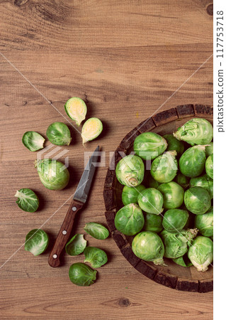fresh Brussels sprouts, raw, top view, on a wooden table, no people, 117753718