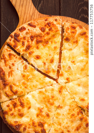 Imereti khachapuri, Traditional Georgian dish, flatbread with cheese, top view, no people, rustic, Imereti khachapuri, Traditional Georgian dish, flatbread with cheese, top view, no people, rustic, 117753756