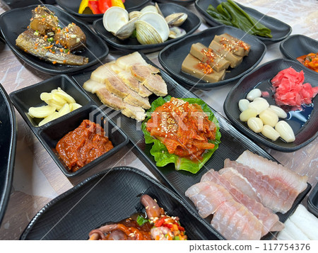 Fermented Skate and Steamed Pork Slices Served with Kimchi 117754376