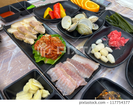 Fermented Skate and Steamed Pork Slices Served with Kimchi 117754377