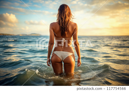 Beautiful body in sunset. Sexy blond girl in Sea 117754566