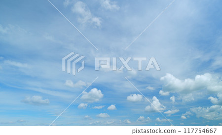 Fluffy layered clouds sky atmosphere. Puffy fluffy white clouds. Formation cloud sky scape. Timelapse. 117754667
