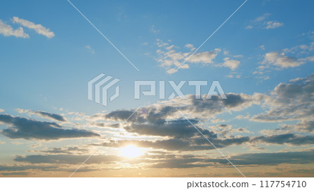 Warm colors of sky and clouds at sunset. Cloud nature background. Timelapse. Warm colors of sky and clouds at sunset. Cloud nature background. Timelapse. 117754710