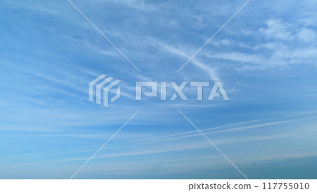 Cloud nature background. Blue sky with clouds and sun. Nature background of airy cloudscape. Timelapse. Cloud nature background. Blue sky with clouds and sun. Nature background of airy cloudscape. Timelapse. 117755010