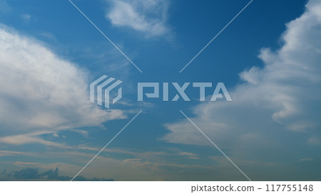 Summer sky. Cirrus clouds on bright blue sky. Wispy cirrus clouds pass over blue sky in nature. Timelapse. Summer sky. Cirrus clouds on bright blue sky. Wispy cirrus clouds pass over blue sky in nature. Timelapse. 117755148