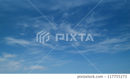 Blue sky cirrus clouds. Scenic aerial background of blue sky with cirrus clouds. Clean azone layer. Timelapse. 117755273