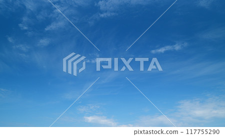 Dynamic cloud time-lapse from calm blue skies to cloudy. Puffy fluffy white clouds. Timelapse. 117755290