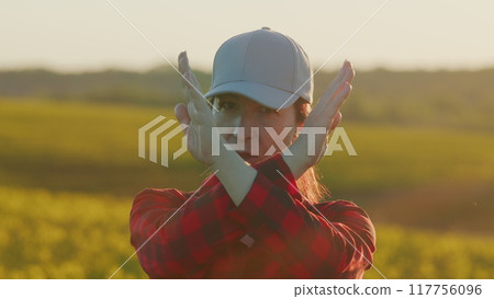 No Way. Serious Young Brunette Farmer Woman Showing Stop Hand Gesture Looking At Camera. Gorgeous Female Girl With Flawless Face Skin Natural Day Make-Up. No Way. Serious Young Brunette Farmer Woman Showing Stop Hand Gesture Looking At Camera. Gorgeous Female Girl With Flawless Face Skin Natural Day Make-Up. 117756096