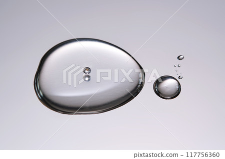 A smear of cosmetic gel close-up on a gray background.  117756360