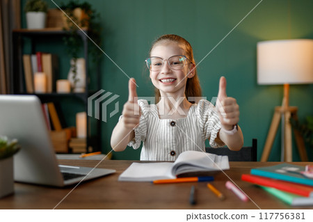 Girl doing homework 117756381
