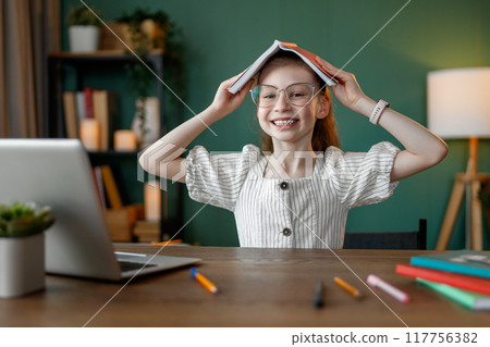 Girl doing homework 117756382