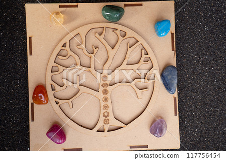 Healing crystals on brown background 117756454