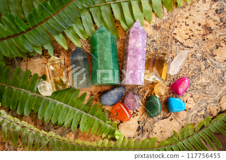 Healing crystals on brown background 117756455