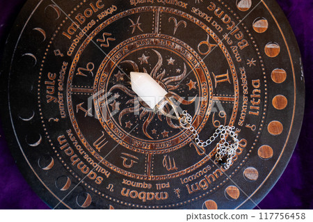 Healing crystals on brown background Healing crystals on brown background 117756458
