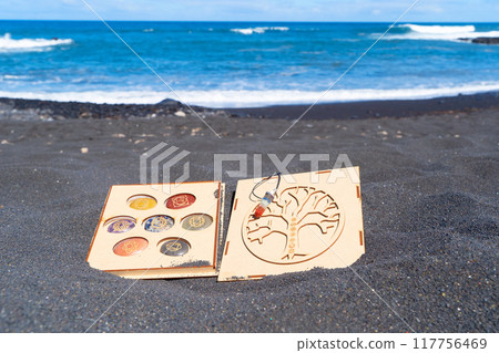 Healing crystals on black sand background 117756469