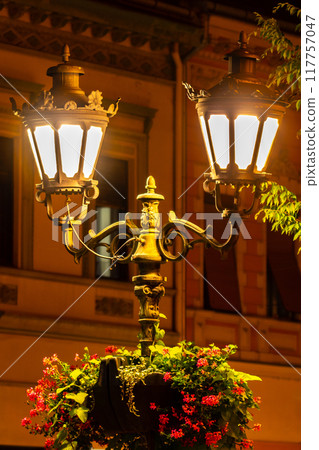 Vintage street iron lamp in the center of Novi sad in Serbia at night Vintage street iron lamp in the center of Novi sad in Serbia at night 117757047