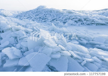 Winter landscape photo with frozen Baltic Sea coast on a sunny day Winter landscape photo with frozen Baltic Sea coast on a sunny day 117757199