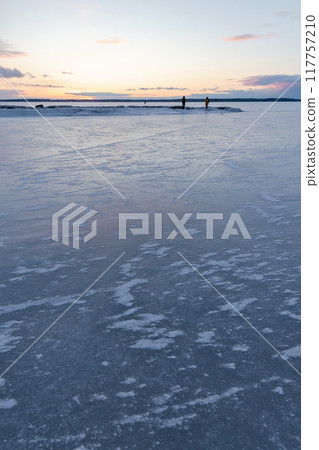 Winter landscape with ice covering frozen Baltic sea Winter landscape with ice covering frozen Baltic sea 117757210