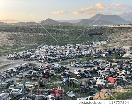 A diverse collection of rusted old vehicles. 117757294