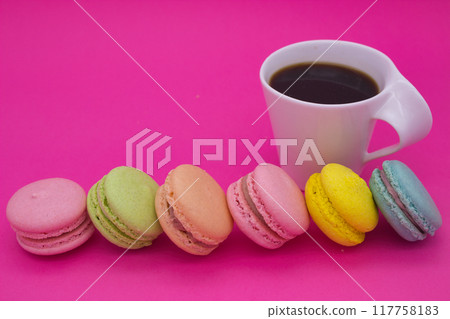 Colorful Macarons and Coffee on Pink Background Colorful Macarons and Coffee on Pink Background 117758183