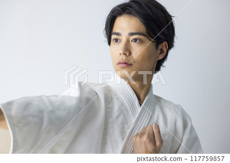 A man practicing karate A man practicing karate 117759857