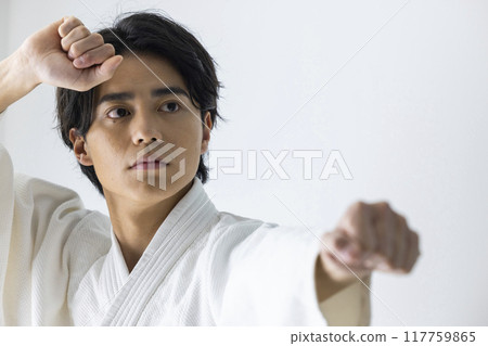 A man practicing karate A man practicing karate 117759865