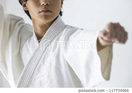 A man practicing karate A man practicing karate 117759866