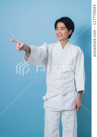A man practicing karate 117759884
