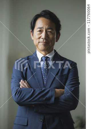 Portrait of a middle-aged man in a suit 117760064