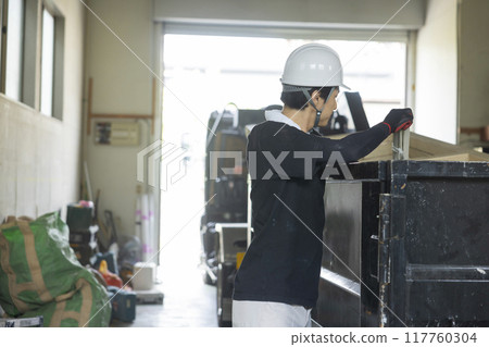 Workers working on a truck 117760304