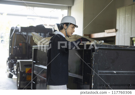 Workers working on a truck 117760306