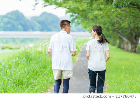 Back view of a senior couple jogging Back view of a senior couple jogging 117760473