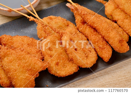 Kushikatsu, skewered fried food, local cuisine, Osaka, whiting, lotus root, shrimp, squid, sauce 117760570