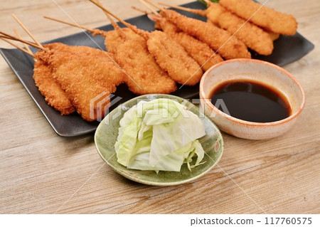 Kushikatsu, skewered fried food, local cuisine, Osaka, whiting, lotus root, shrimp, squid, sauce Kushikatsu, skewered fried food, local cuisine, Osaka, whiting, lotus root, shrimp, squid, sauce 117760575
