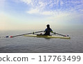 Women rowing training on a canoe or kayak in the morning at sea 117763499
