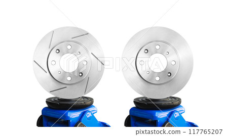 Slotted brake rotor and solid brake rotor on a hydraulic car jack isolated on white background 117765207