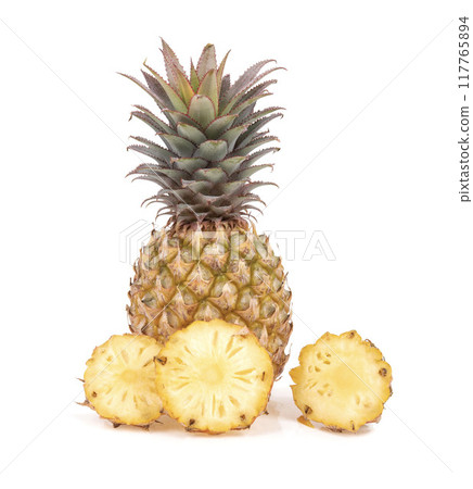 Pineapple with cut in half and slices isolated on white background. Pineapple with cut in half and slices isolated on white background. 117765894