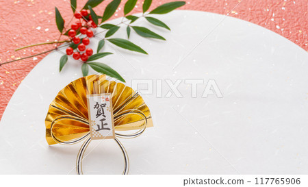 A Japanese-style background of a gold fan with the characters "Happy New Year" written on red and white Japanese paper 117765906