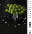 Delicious juicy Shine Muscat grapes on a glass plate 117767277